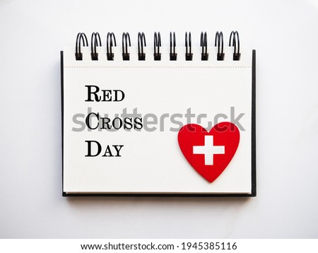 Red Cross Day. Beautiful greeting card. Close-up, view from above. National holiday concept. Congratulations for family, relatives, friends and colleagues