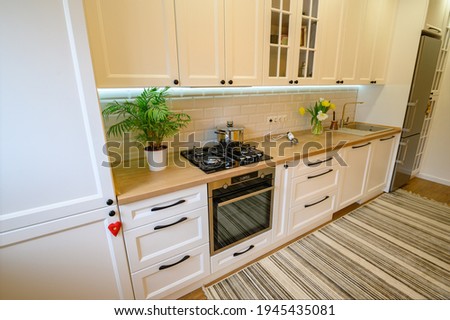 cozy well designed modern kitchen interior with appliances, high angle view Royalty-Free Stock Photo #1945435081