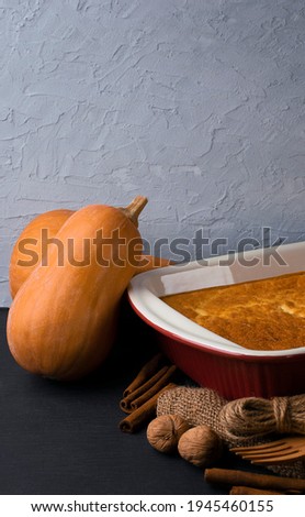 Harvest. Ripe pumpkins in a basket. Healthy eating. Pumpkin dishes. Autumn rustic background. Vegetable pumpkin poster or wallpaper. Pumpkin cooking master class. Autumn recipe picture.