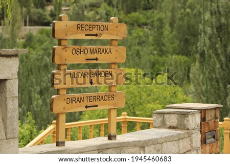 Tourist guide board at the entrance of hotel in Hunza Valley, Pakistan