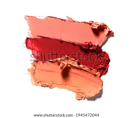 Smudged lipstick different colors isolated on white background