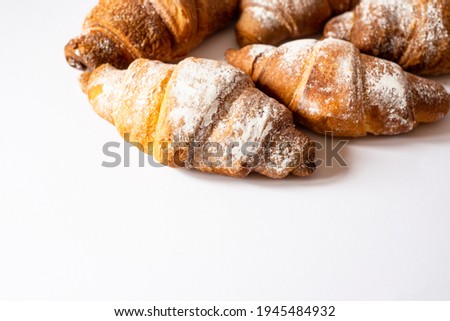 Croissants on a white background. With chocolate for breakfast. For cafes, restaurants, advertising.