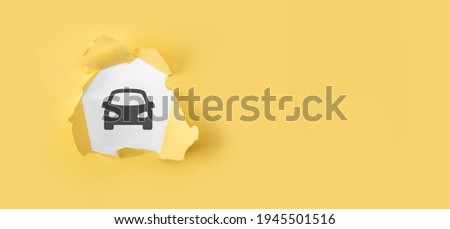 Car automobile insurance and car services concept. Torn yellow paper with auto machine car icon on white background.