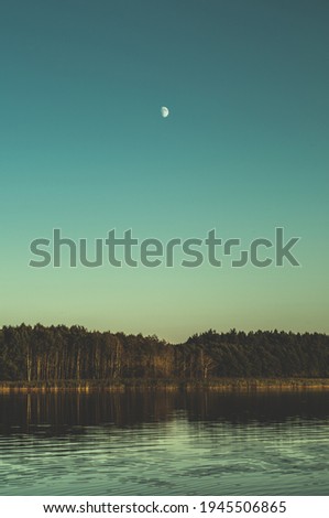 moon over the lake in the evening time