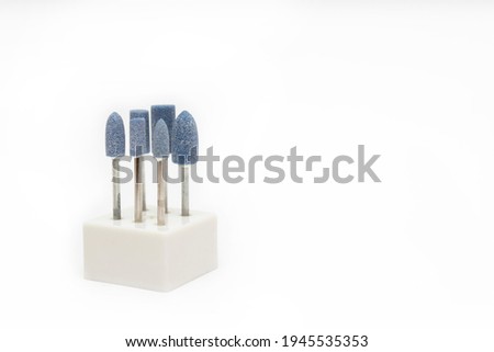 Cutters for hardware manicure and pedicure. Accessories and manicure nail tool. Milling cutter for manicure. Copy space concept. Royalty-Free Stock Photo #1945535353