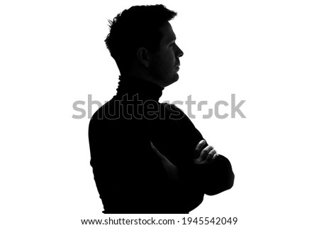 Silhouette of caucasian mature serious man in black poloneck