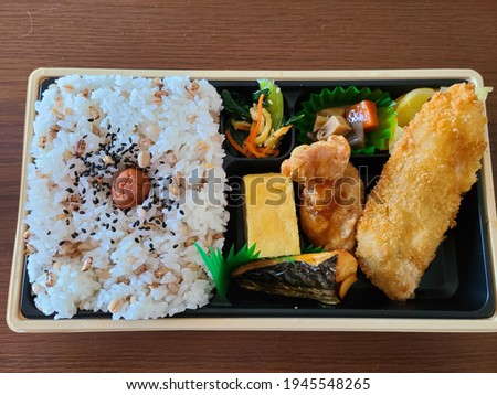 Fried chicken and fish bento.