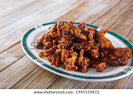 A view of a plate of orange chicken.