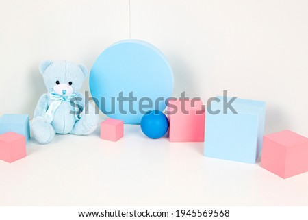 Composition of colorful educational baby kid toys and geometric shapes cubes, podiums, platforms on white background