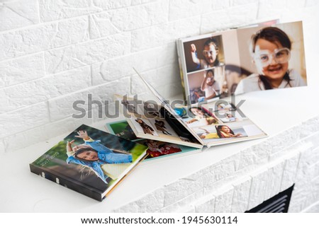 photobook of a little girl. Family, childhood and leisure concept