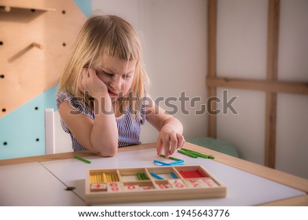 Caucasian girl does not want to learn to count at home in the classroom, preschool education for children, mathematics for children, lessons for elementary school, angry child is naughty