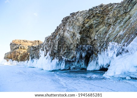 Frozen caves at the lake Baikal in winter in Russia.