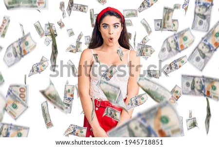 Brunette teenager girl wearing elegant look afraid and shocked with surprise expression, fear and excited face.