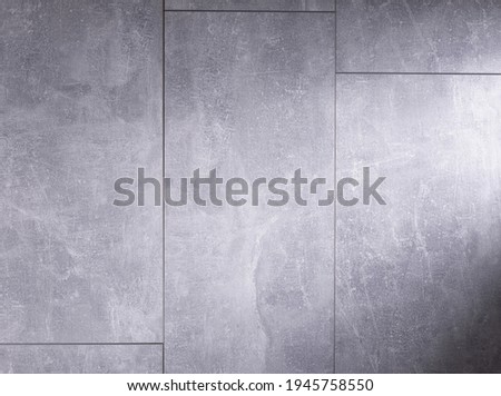 Stone or marble surface background of tile floor or wall texture.  Grey laminate background with copy space