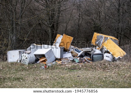 Abandoned disposed electronic waste, household equipment in nature
