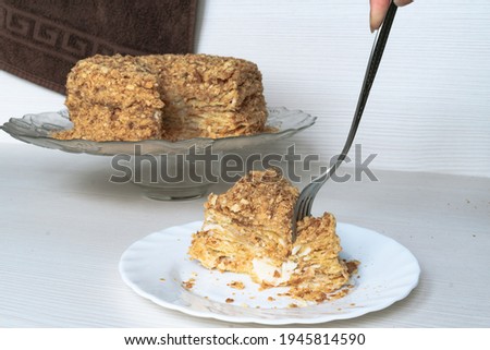 Piece of delicious napoleon cake and fork