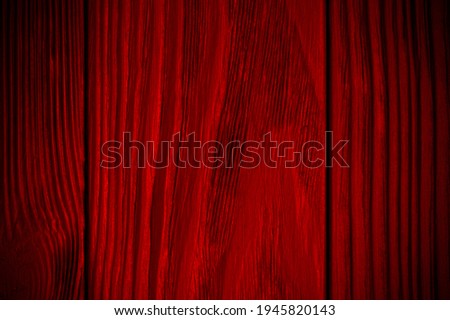 red textured wooden background with black. Vignette. Vintage bright background. Wood texture. High quality photo