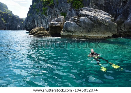 Diver at El Nido Palawan Paradise in the Philippines, Island hopping, dive spot, beautiful beaches ,cliffs, nature Royalty-Free Stock Photo #1945832074