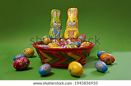                 Easter basket with eggs and bunnies                                  