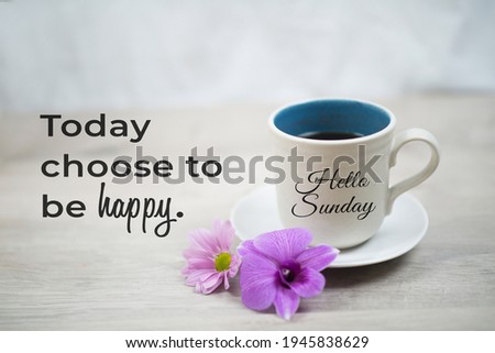 Sunday inspirational quote -  Today choose to be happy. With hello Sunday greeting on cup of morning coffee and purple orchid daisy flowers on white table background. Happy Sunday weekend concept. Royalty-Free Stock Photo #1945838629