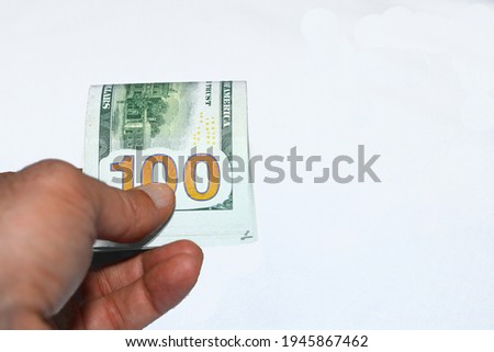 100 dollars portrait, one hundred American dollars background, selective focus, united states dollars banknote, American currency background, young man hand giving stack of 100 dollars