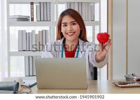 Portrait asian female very pretty and beautiful woman wearing red sleeveless dress standing and smiling to teeth white with feel happy and confident in room with bedroom in the morning.