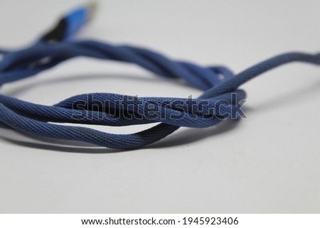 The cable is blue on a white background