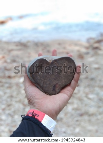 nature heart shape rock cause by the waves that hit the island