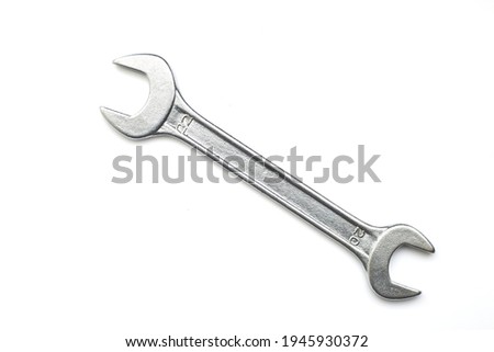 Wrench isolated on white background. Top view. Clipping path Royalty-Free Stock Photo #1945930372