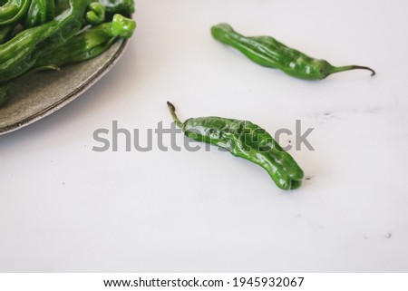 Fresh Green Shishito Peppers Marble Background