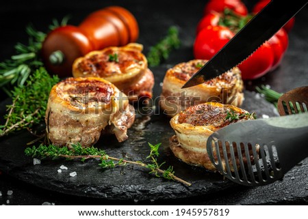 Healthy lean grilled medium-rare beef steak. beef tenderloin steak covered bacon. Food recipe background. Close up.