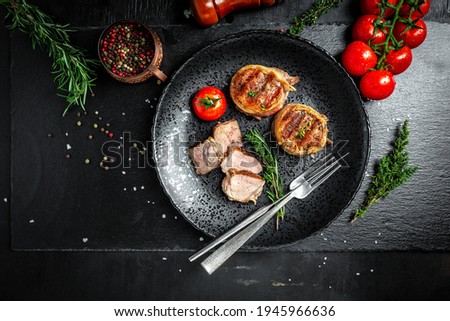 Grilled beef steak. filet Mignon beef tenderloin steak covered bacon with spices. Long banner format. top view.