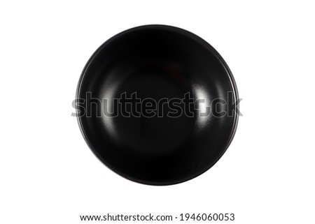 black empty ceramic plate on a white background