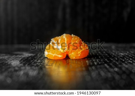 Tangerines on dark wooden background