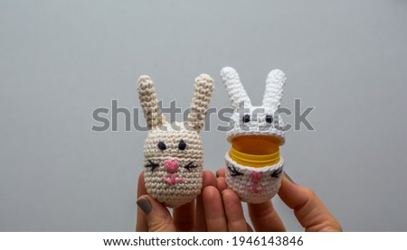 Handmade crochet, knitted rabbit, bunny creative decoration. Easter postcard. Happy easter background.