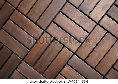 Brown wooden decking tiles. Floor coverings for apartments and houses