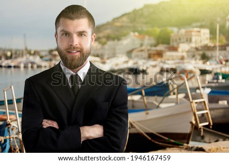 Happy young man posing on nature background