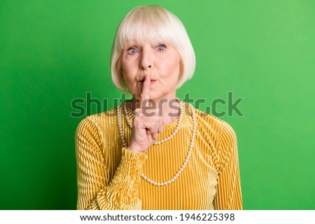 Photo of old lovely cute woman grandmother cover close lips mute silence isolated on green color background Royalty-Free Stock Photo #1946225398