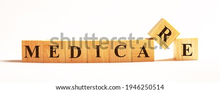 On a light background, wooden cubes with the text MEDICARE