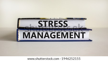 Stress management symbol. Books with words 'Stress management'. Beautiful white background. Psychological, business and stress management concept. Copy space.
