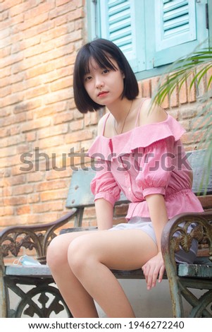 asia thai teen pink t-shirt beautiful girl smile and relax