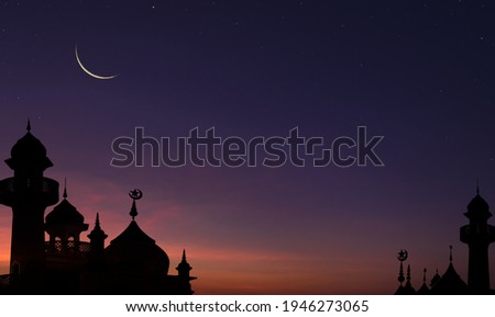 Mosques Dome on dark blue twilight sky and Crescent Moon on background, symbol islamic religion Ramadan and free space for text arabic, Eid al-Adha, Eid al-fitr,New year Muharram  Royalty-Free Stock Photo #1946273065