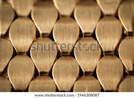 Abstract jewelry background. Gold metal ornament. Interlacing surface. Decoration for design. Selective focus. High quality photo