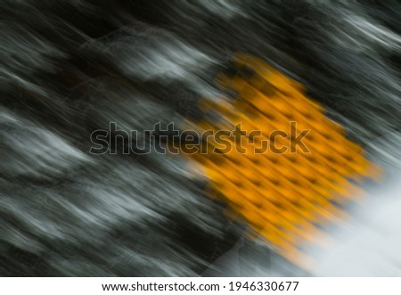 intentionally blurred road hazard sign done by zooming lens and long time exposure signs of too much alcohol consumption for don't drink and drive background wallpaper room for type or logo 