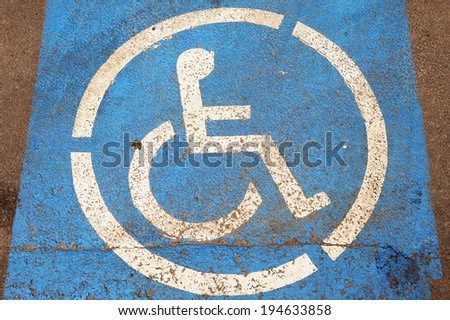 Blue painted parking space reserved for handicapped 