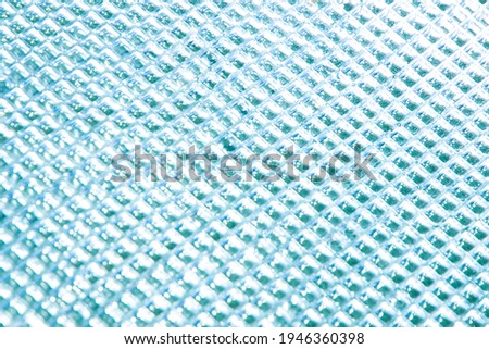abstract light blue curly glass background, tinted, soft focus
