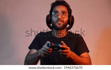 man playing game w\using gaming wireless joystick