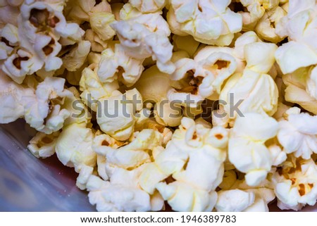 Macro selective focus on popcorn with butter. Popcorn background