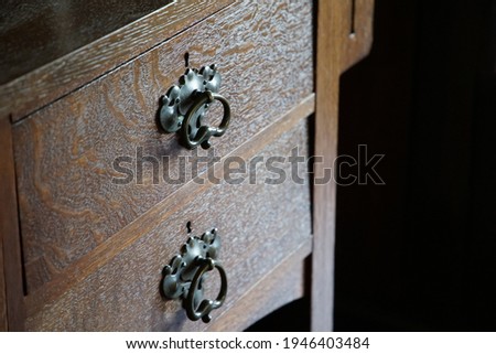 Old wooden desk drawer in the room                                Royalty-Free Stock Photo #1946403484