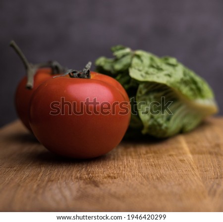 Tomatoes and salad in a kitchen - studio photography